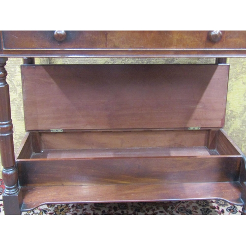 1504 - An early Victorian mahogany washstand raised on turned supports with box base, frieze drawer and rai... 