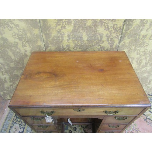 1508 - A George III mahogany kneehole desk of diminutive proportions,  fitted with seven drawers and recess... 