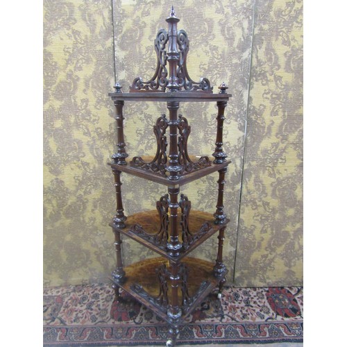 1510 - A Victorian walnut and figured walnut four tier graduated corner whatnot on turned supports, 145cm h... 