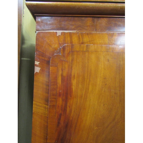 1511 - A William IV mahogany linen press, the lower section enclosed by three long drawers with carved knob... 