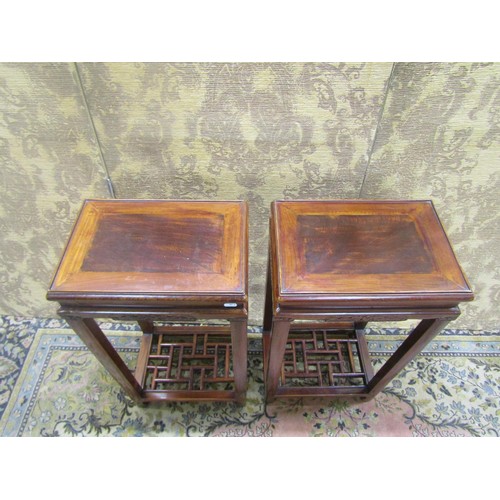 1517 - A pair of Chinese hardwood rectangular side tables, with carved frieze and lattice work under galler... 