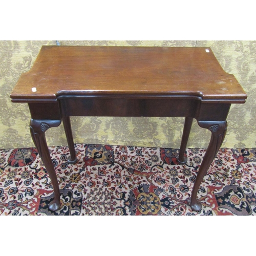 1519 - A Georgian mahogany fold over top card table with turret corners, raised on pad feet with further ca... 