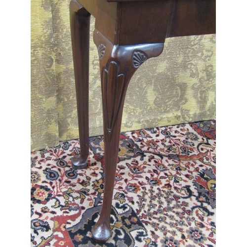 1519 - A Georgian mahogany fold over top card table with turret corners, raised on pad feet with further ca... 