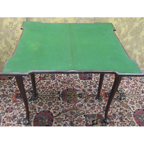 1519 - A Georgian mahogany fold over top card table with turret corners, raised on pad feet with further ca... 