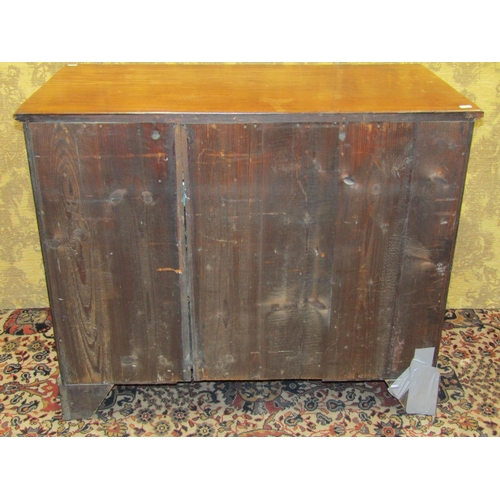 1522 - A George III mahogany kneehole writing desk, the central alcove partially enclosed by a panelled doo... 