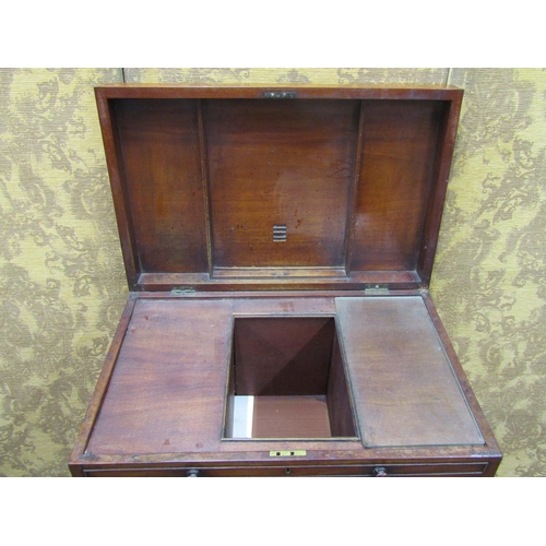 1523 - A 19th century mahogany gentleman's commode with rising lid, the front elevation enclosed by a serie... 