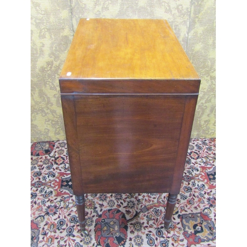 1523 - A 19th century mahogany gentleman's commode with rising lid, the front elevation enclosed by a serie... 