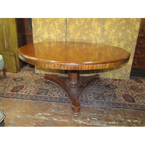 1533 - A large early Victorian mahogany snaptop breakfast table raised on a hexagonal column and large tric... 