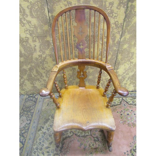 1535 - A 19th century comb back Windsor chair in mixed woods, elm, ash, etc, with pierced splat, stamped to... 