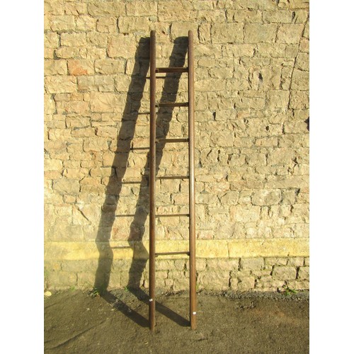 1540 - A rustic antique oak folding 6-run library ladder, 227cm