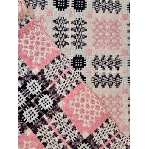 895 - Traditional woollen welsh blanket in reversible double weave, colours are pink, black and white.  25... 