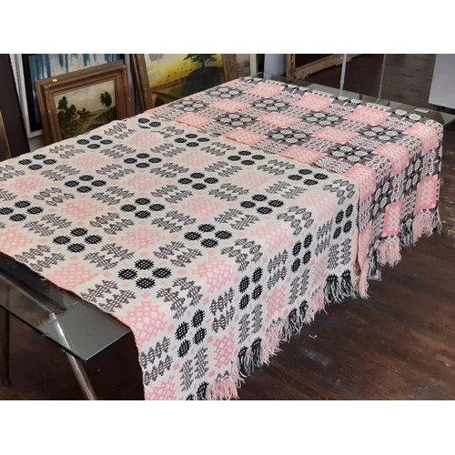 895 - Traditional woollen welsh blanket in reversible double weave, colours are pink, black and white.  25... 