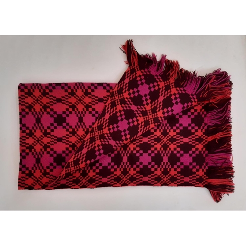 898 - Rug/ travel blanket woven  in the traditional Welsh style with reversible pattern in magenta, coral ... 