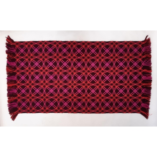 898 - Rug/ travel blanket woven  in the traditional Welsh style with reversible pattern in magenta, coral ... 