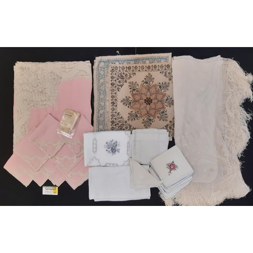 907 - A collection of vintage textiles including an unusual 1930's table linen set of pink cloth and 8 nap... 