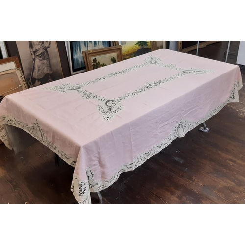 907 - A collection of vintage textiles including an unusual 1930's table linen set of pink cloth and 8 nap... 