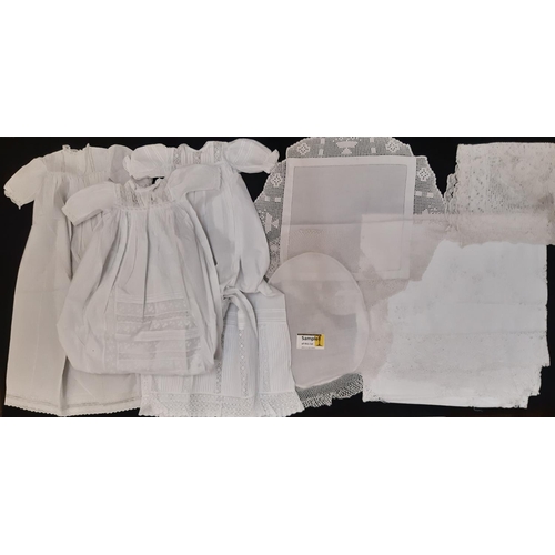 911 - Four early 20th century baby gowns  with lace, broderie anglaise and pin tuck detail, together with ... 