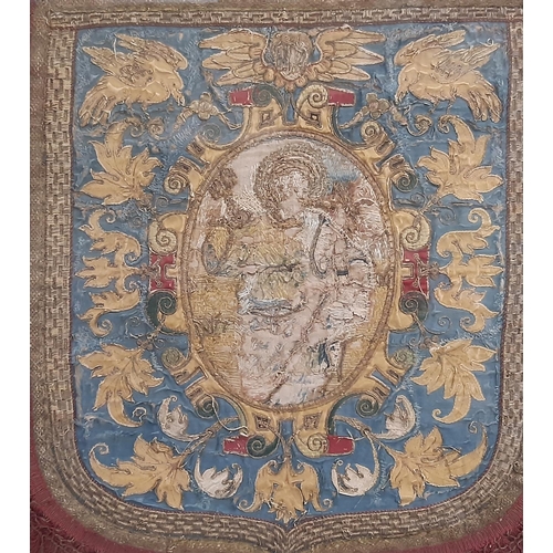 914 - A 19th century ecclesiastic banner in shield form with central figure of St Peter (indistinct) holdi... 