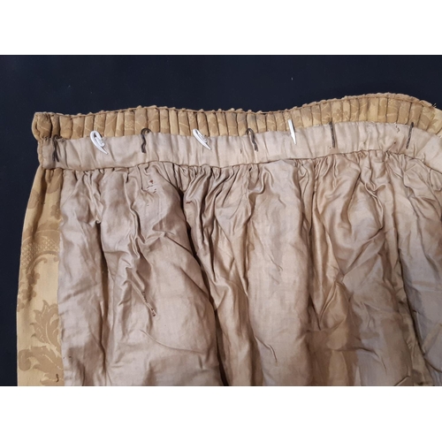 893 - One pair of vintage extra long gold damask curtains, lined and thermal lined with pencil pleat headi... 