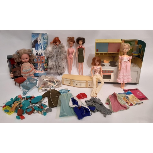 921 - A collection of vintage dolls and accessories including an early 1960's short haired Sindy doll, a U... 