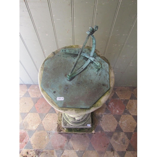 1047 - A  two sectional weathered cast composition stone garden sundial, the octagonal verdigris dial set o... 