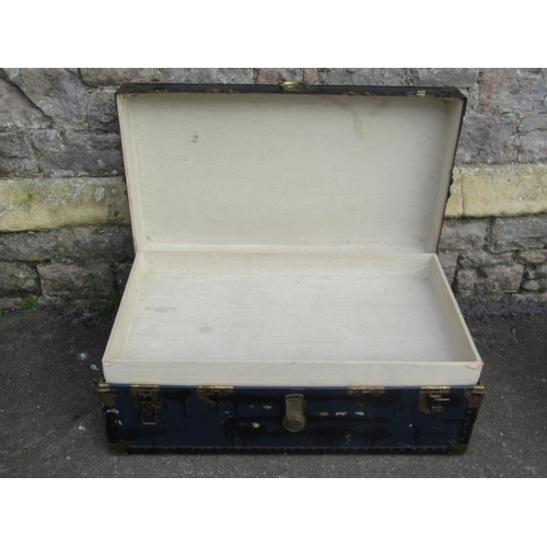 1087 - A vintage fibre and overlaid cabin trunk with stitched leather carrying handles together with two fu... 