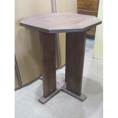 1139 - A sturdy Art Deco style oak occasional table, the octagonal top raised on boarded vertical slatted s... 