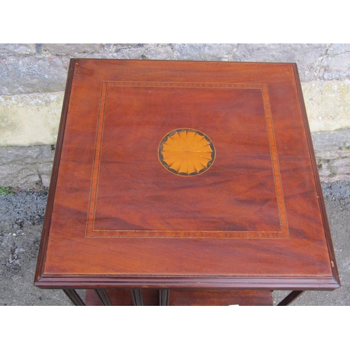 1140 - An inlaid mahogany floorstanding revolving bookcase of usual square cut form, 78 cm high x 48 cm squ... 