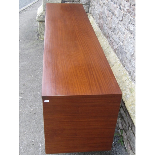 1150 - A Mid 20th century long and low teak sideboard by Elliotts of Newbury, partially enclosed by side cu... 