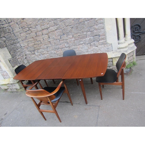 1151 - Mid 20th century teak extending table and four matchings chairs by Elliotts of Newbury, the table wi... 