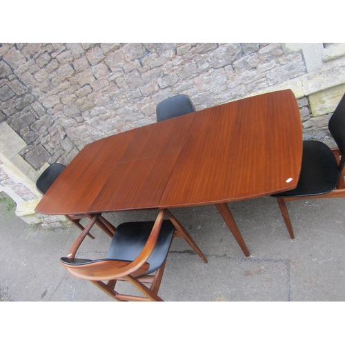 1151 - Mid 20th century teak extending table and four matchings chairs by Elliotts of Newbury, the table wi... 