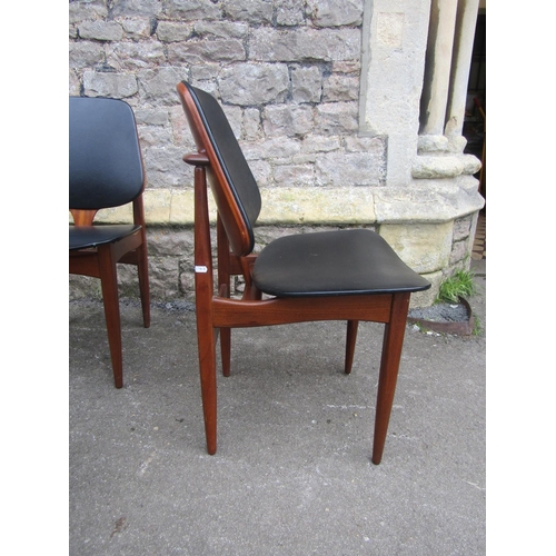 1151 - Mid 20th century teak extending table and four matchings chairs by Elliotts of Newbury, the table wi... 