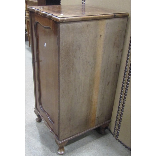 1168 - An Edwardian walnut pedestal side cupboard enclosed by a rectangular moulded panelled door set on sh... 