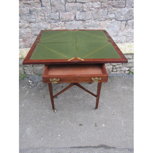 1171 - An Inlaid Edwardian mahogany envelope card table with satinwood crossbanding and boxwood stringing a... 