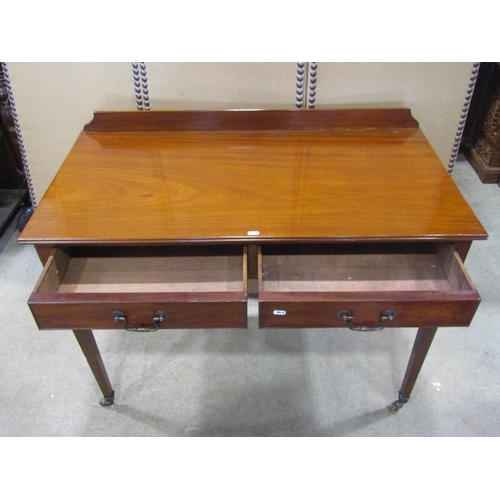 1176 - A 19h century mahogany side table with two frieze drawers on square tapered legs with brass cup cast... 