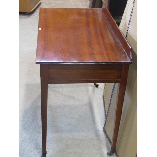 1176 - A 19h century mahogany side table with two frieze drawers on square tapered legs with brass cup cast... 