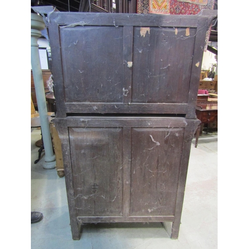 1177 - A Victorian gothic oak two sectional side cupboard in the old English style, the front elevation enc... 