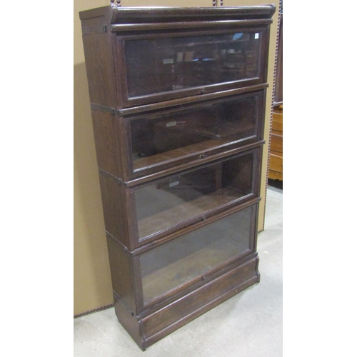 1179 - A Globe Wernicke & Co Ltd oak floorstanding four sectional library  bookcase with up and over rectan... 