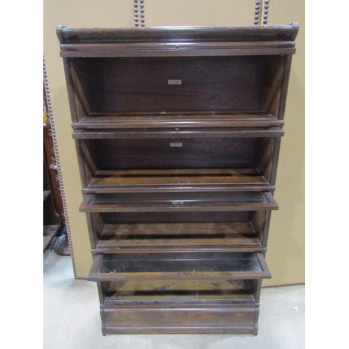 1179 - A Globe Wernicke & Co Ltd oak floorstanding four sectional library  bookcase with up and over rectan... 