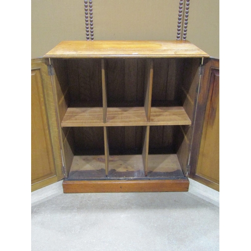 1186 - An Edwardian oak two door side cupboard 82 cm high x 76 cm wide x 41 cm deep