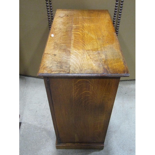 1186 - An Edwardian oak two door side cupboard 82 cm high x 76 cm wide x 41 cm deep