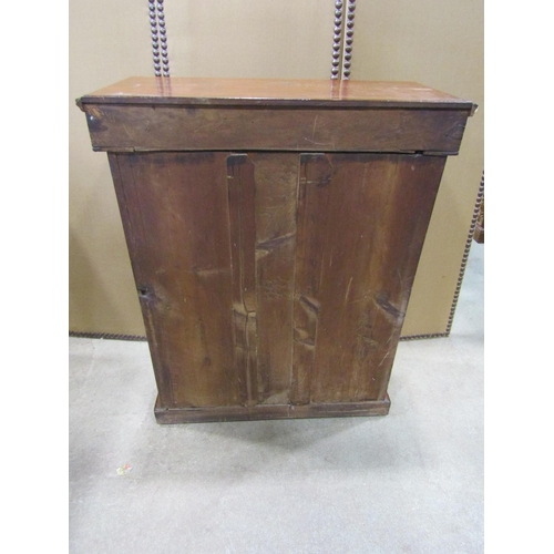 1187 - A Victorian walnut pier Cabinet with inlaid detail  enclosed by a rectangular glazed panelled door s... 