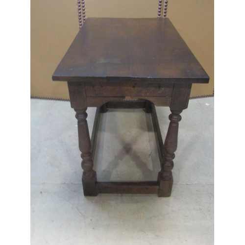 1200 - An antique  oak side/centre table of rectangular form raised on turned and block supports united by ... 