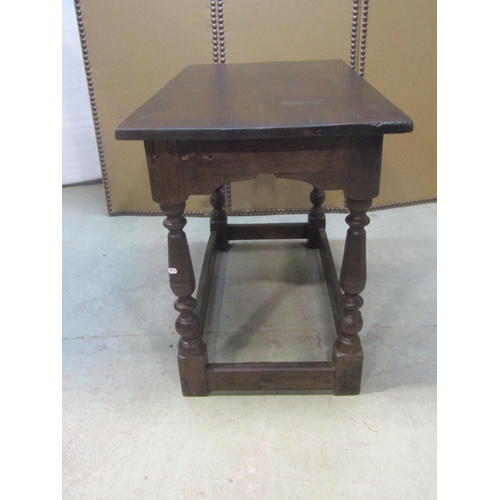 1200 - An antique  oak side/centre table of rectangular form raised on turned and block supports united by ... 