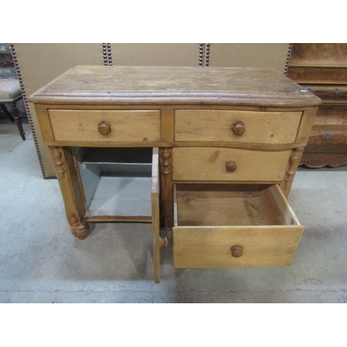 1203 - A small Victorian stripped pine  kitchen dresser with serpentine front enclosed by recessed moulded ... 