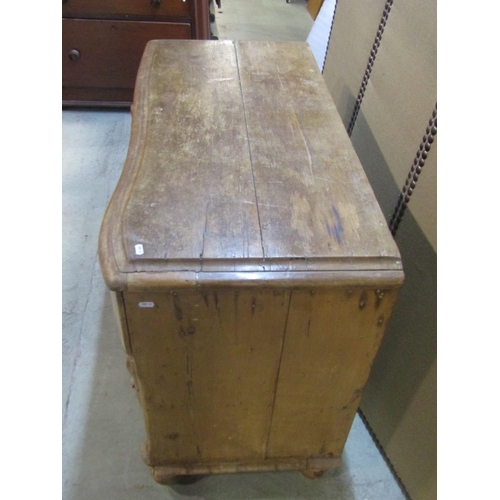 1203 - A small Victorian stripped pine  kitchen dresser with serpentine front enclosed by recessed moulded ... 