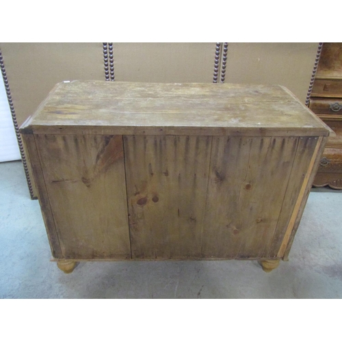 1203 - A small Victorian stripped pine  kitchen dresser with serpentine front enclosed by recessed moulded ... 