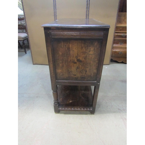 1206 - A good quality old English style oak side cupboard enclosed by a pair of rectangular panelled doors ... 