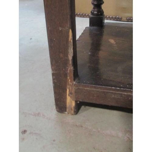 1206 - A good quality old English style oak side cupboard enclosed by a pair of rectangular panelled doors ... 