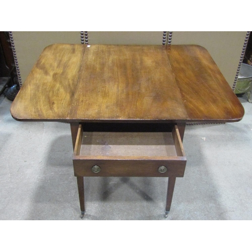 1209 - A 19th century mahogany Pembroke table with frieze drawer raised on square tapered supports with bra... 